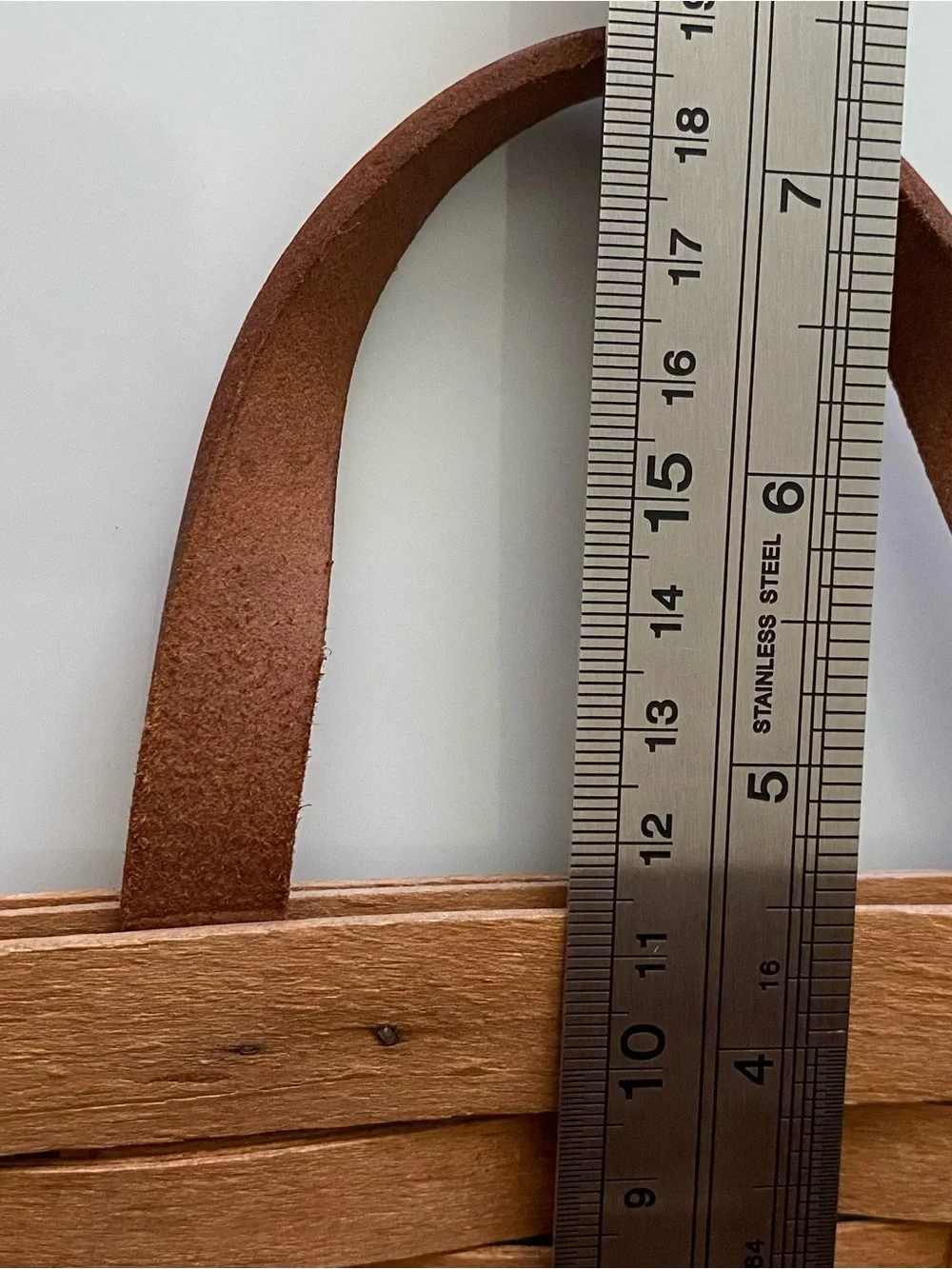 Vintage handwoven Longaberger Medium Key Basket with a leather handle.